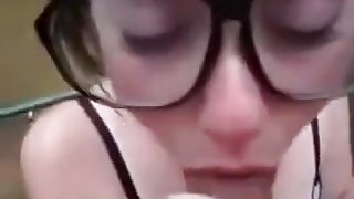 Nerdy girl is sucking on my dick with all the passion she has